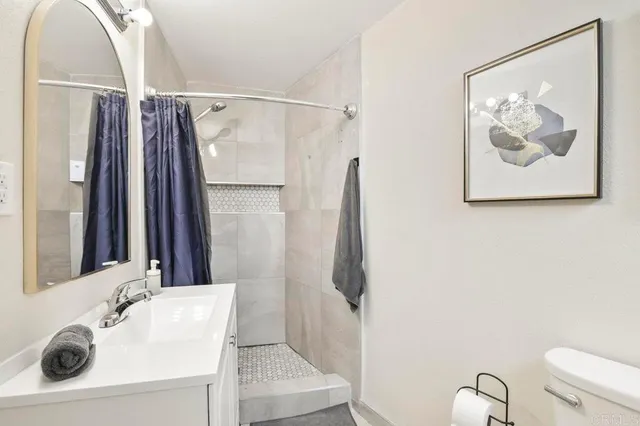 a bedroom with a bed and a table in it