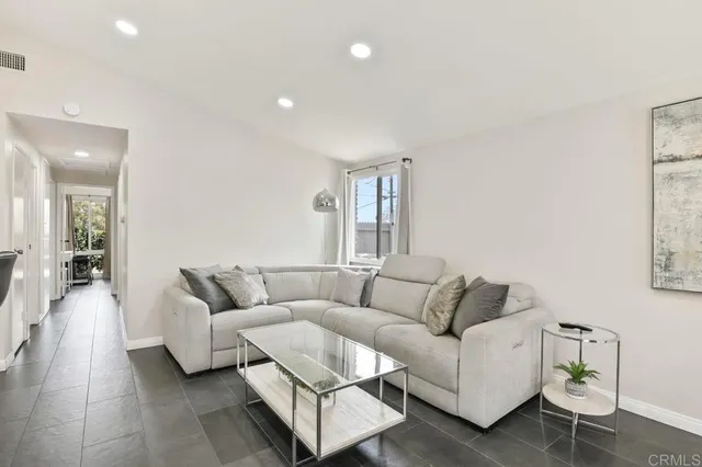 a living room with furniture and a couch