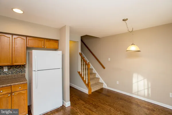 a view of an entryway with wooden floor