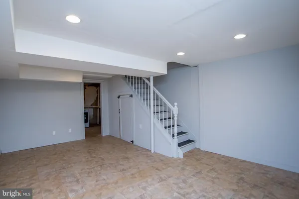 a view of an empty room with stairs