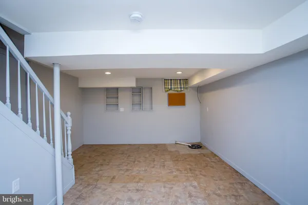 a view of a hallway with staircase