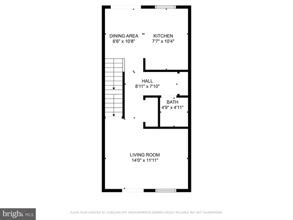 a picture of a bench in front of a wall