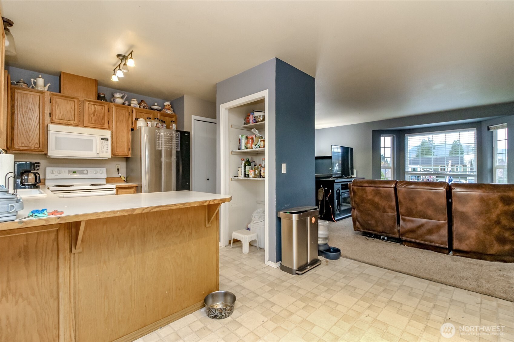 249 South Elsa Street Buckley, WA 98321 - Photo 18 of 37 a view of kitchen with furniture and refrigerator