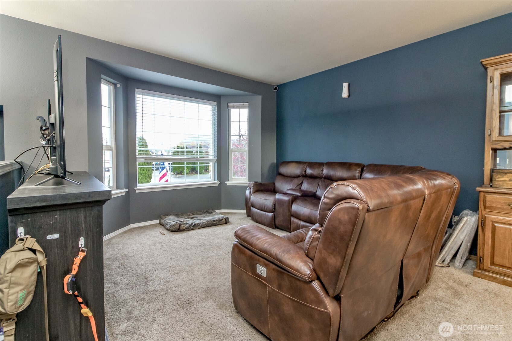 249 South Elsa Street Buckley, WA 98321 - Photo 19 of 37 a bed sitting in a bedroom next to a window