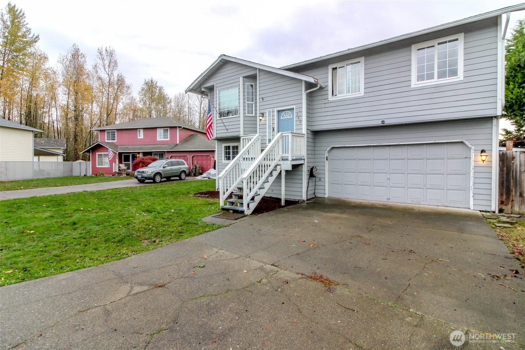 249 South Elsa Street Buckley, WA 98321 - Photo 2 of 37 a front view of a house with a yard and garage