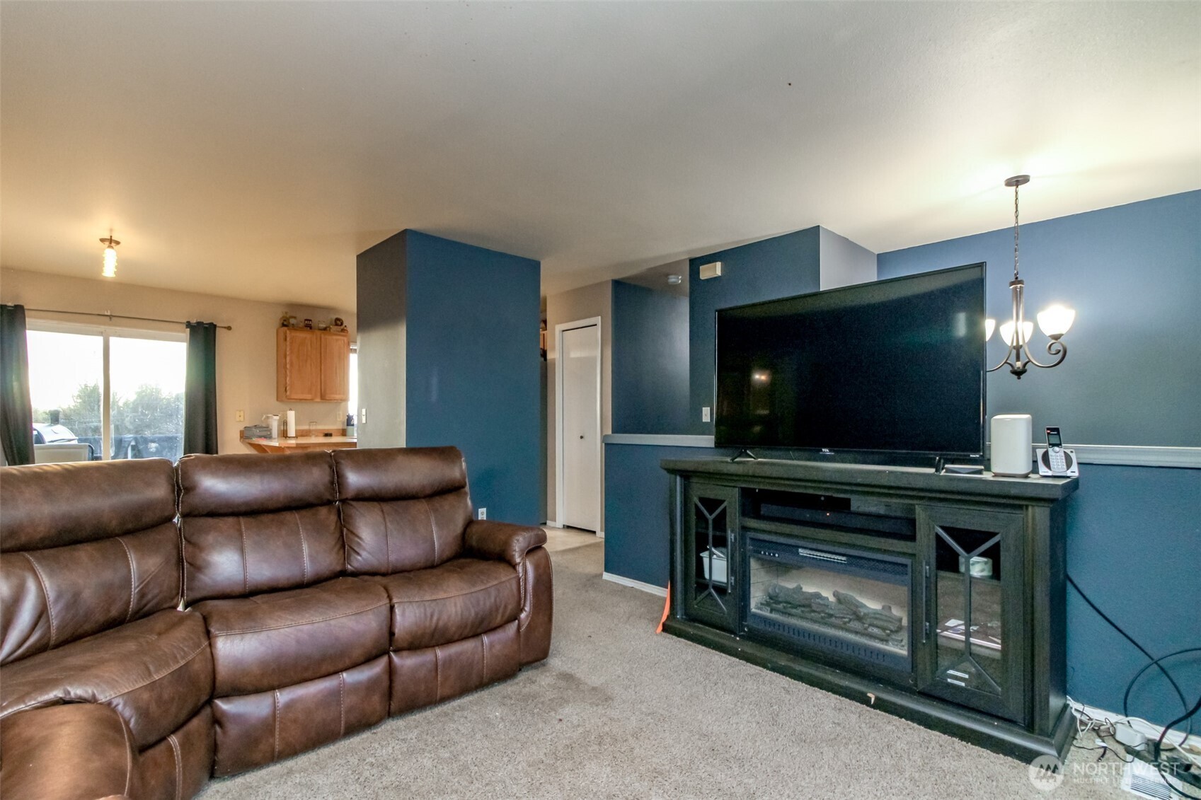 249 South Elsa Street Buckley, WA 98321 - Photo 21 of 37 a living room with furniture and a flat screen tv