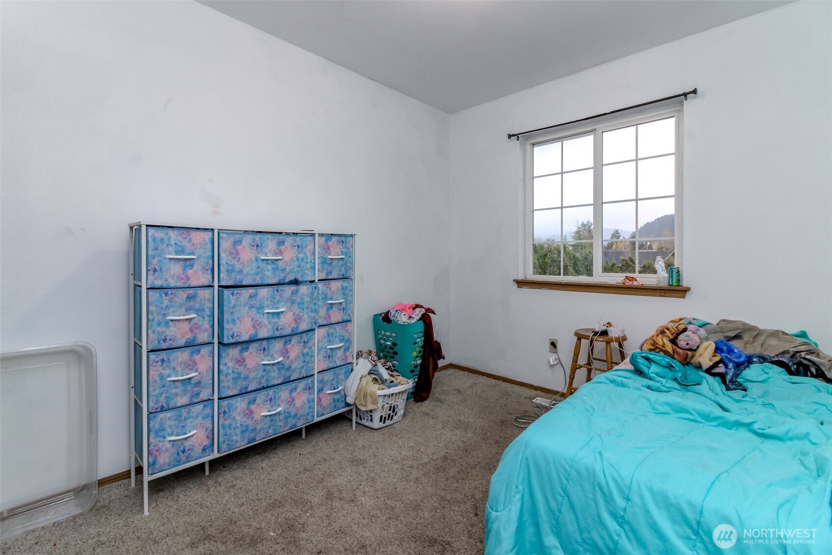 249 South Elsa Street Buckley, WA 98321 - Photo 24 of 37 a bed room with a bed and a window