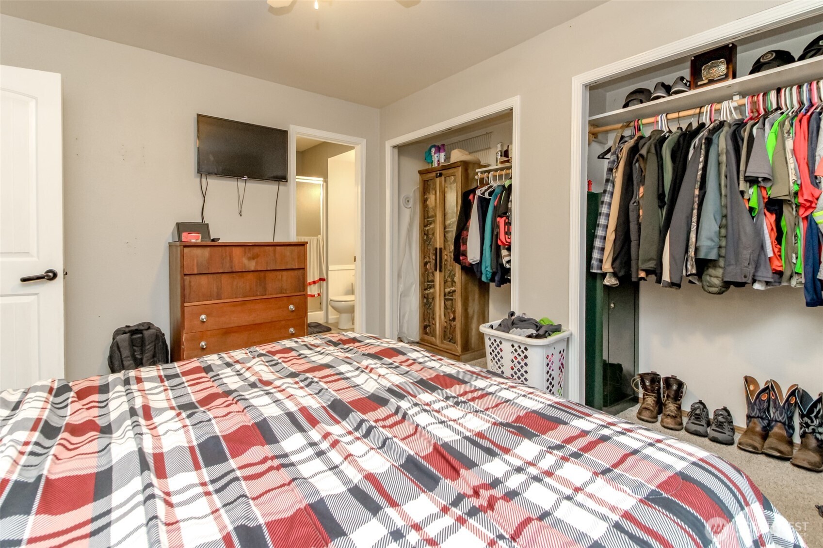 249 South Elsa Street Buckley, WA 98321 - Photo 27 of 37 a bedroom with a bed and a flat tv screen