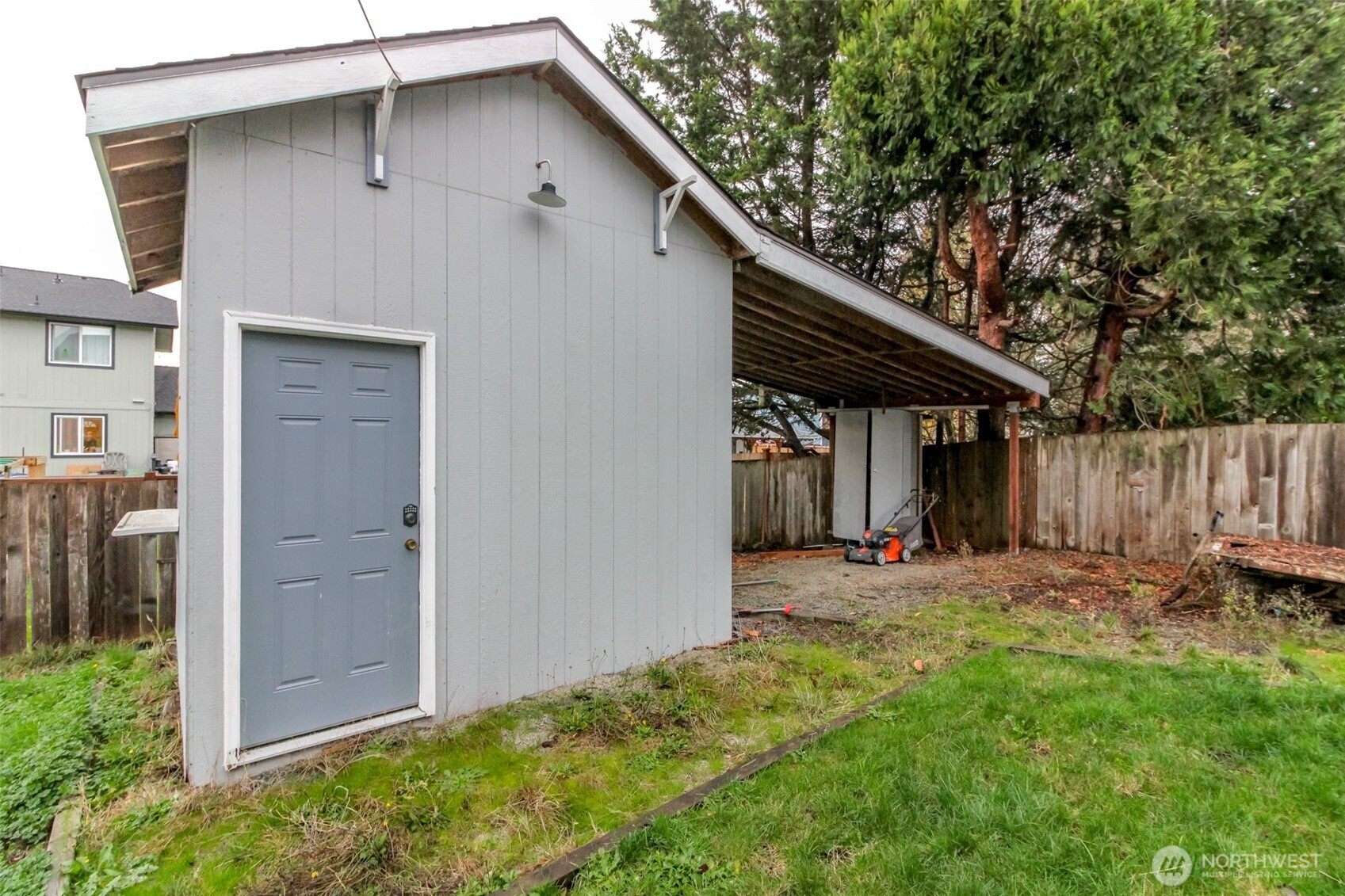 249 South Elsa Street Buckley, WA 98321 - Photo 34 of 37 a backyard of a house with chairs and table