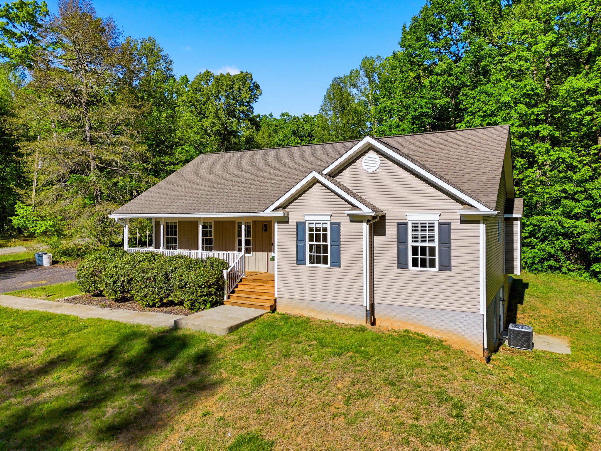 1522 Meander Run Road Locust Dale, VA 22948 - Photo 5 of 72 a front view of a house with a yard
