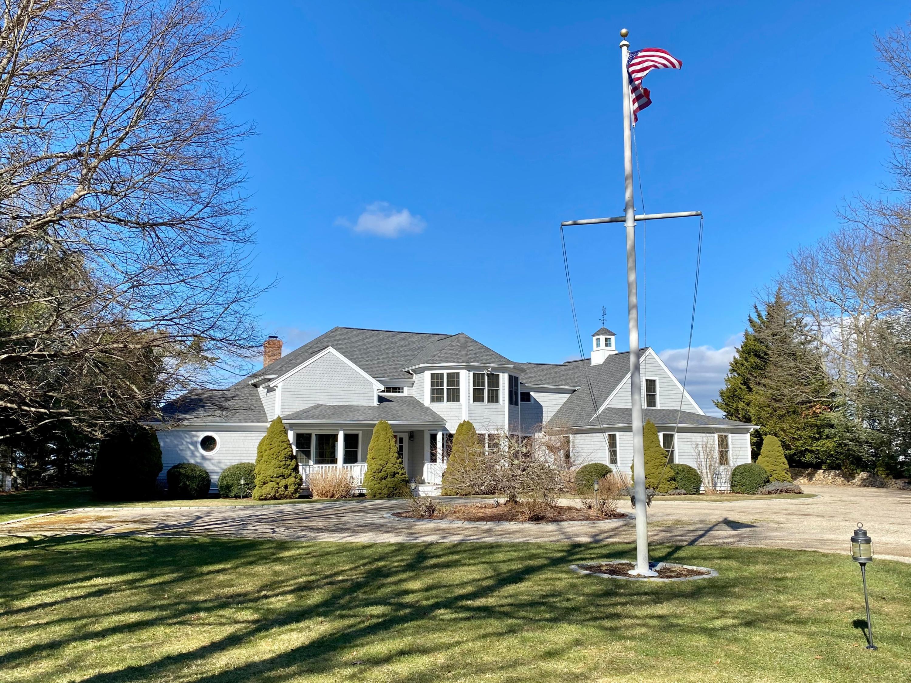 294 Cairn Ridge Road East Falmouth, MA 02536 - Photo 1 of 29 a front view of a house with a yard