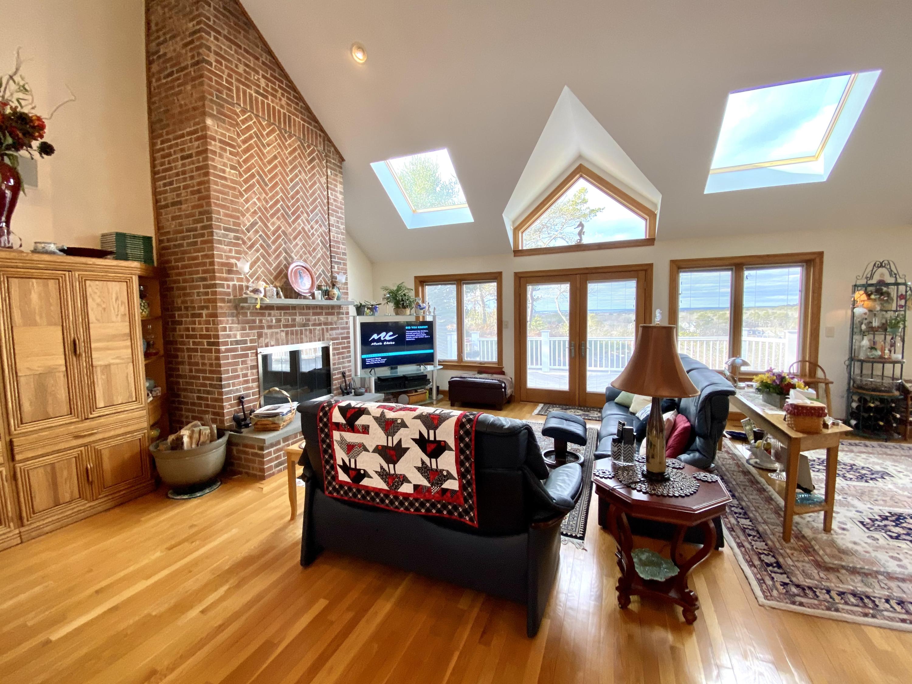 294 Cairn Ridge Road East Falmouth, MA 02536 - Photo 12 of 29 a living room with furniture and a large window