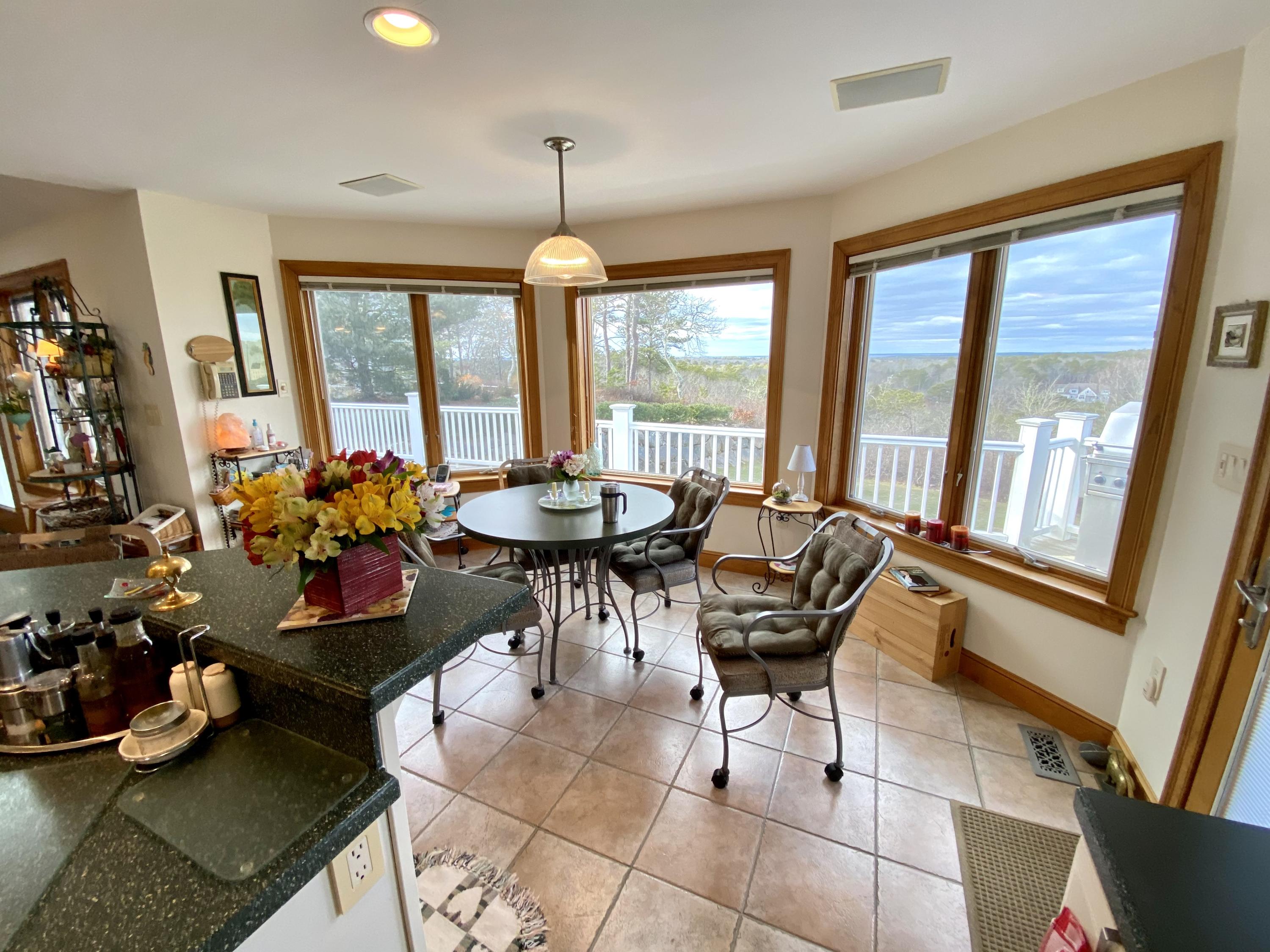 294 Cairn Ridge Road East Falmouth, MA 02536 - Photo 22 of 29 a view of a dining room with furniture window and outside view