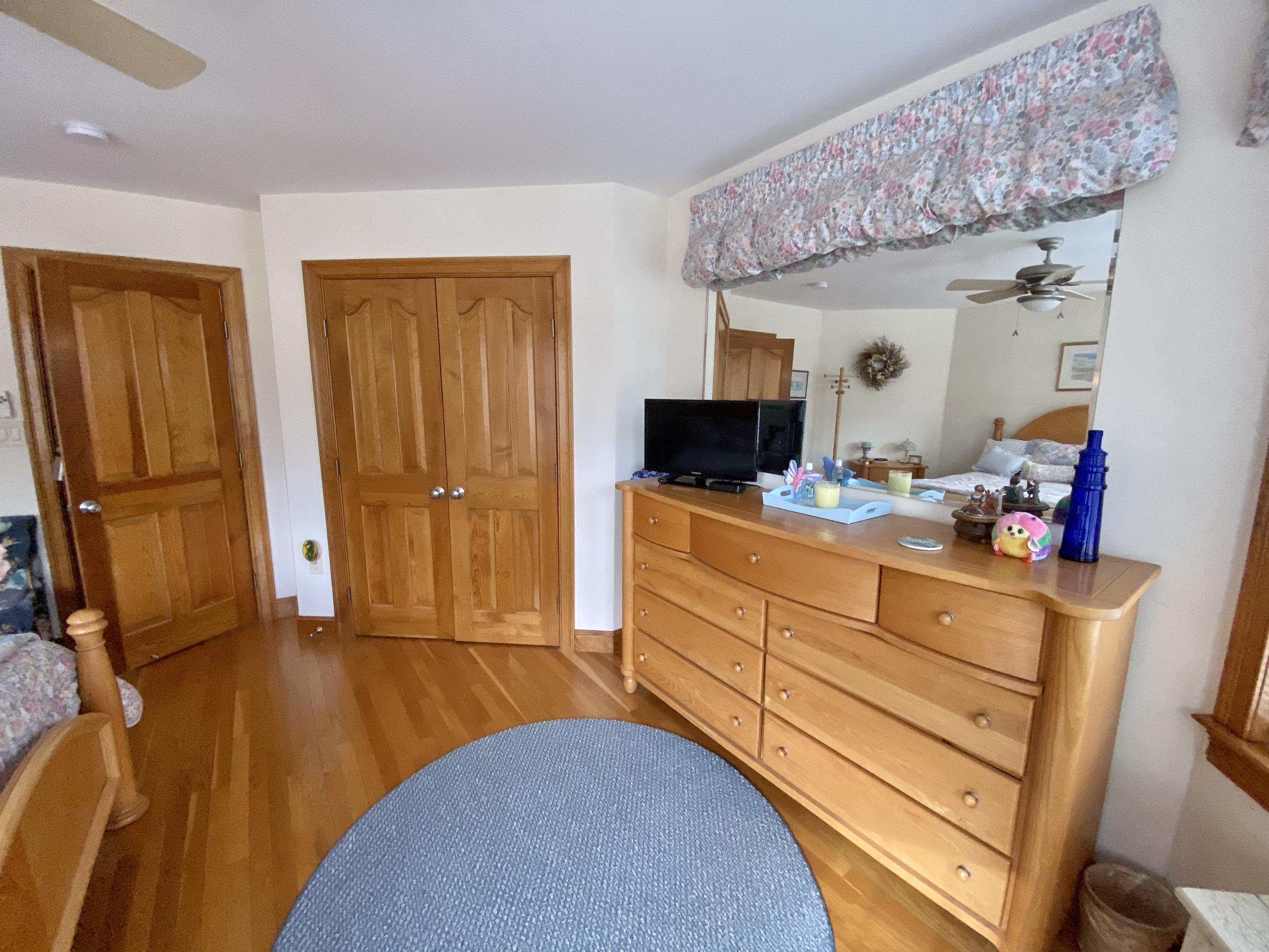 294 Cairn Ridge Road East Falmouth, MA 02536 - Photo 23 of 29 a bed room with a bed and a television