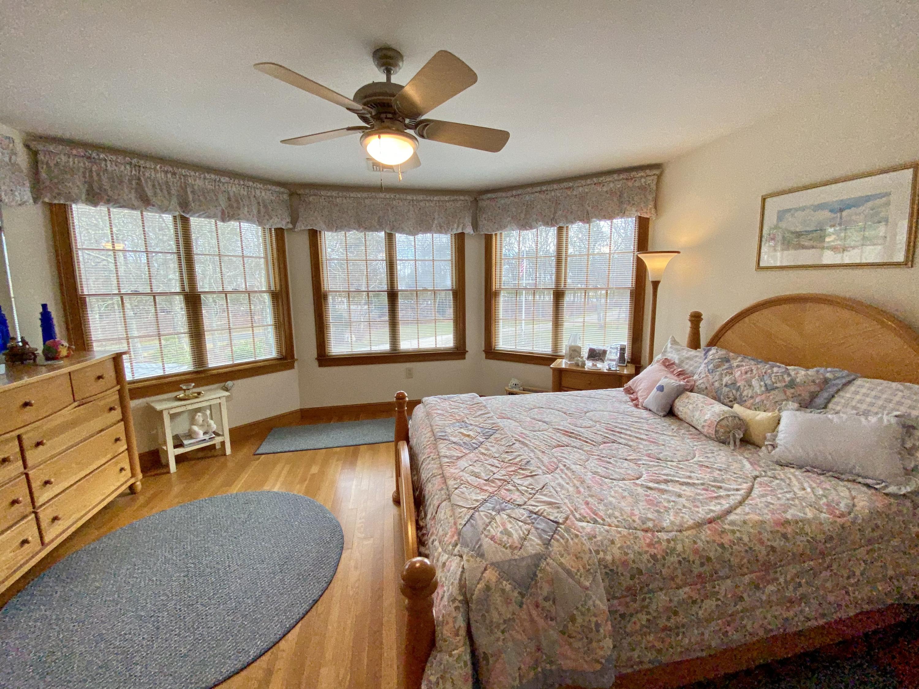 294 Cairn Ridge Road East Falmouth, MA 02536 - Photo 28 of 29 a bedroom with a bed furniture and a large window