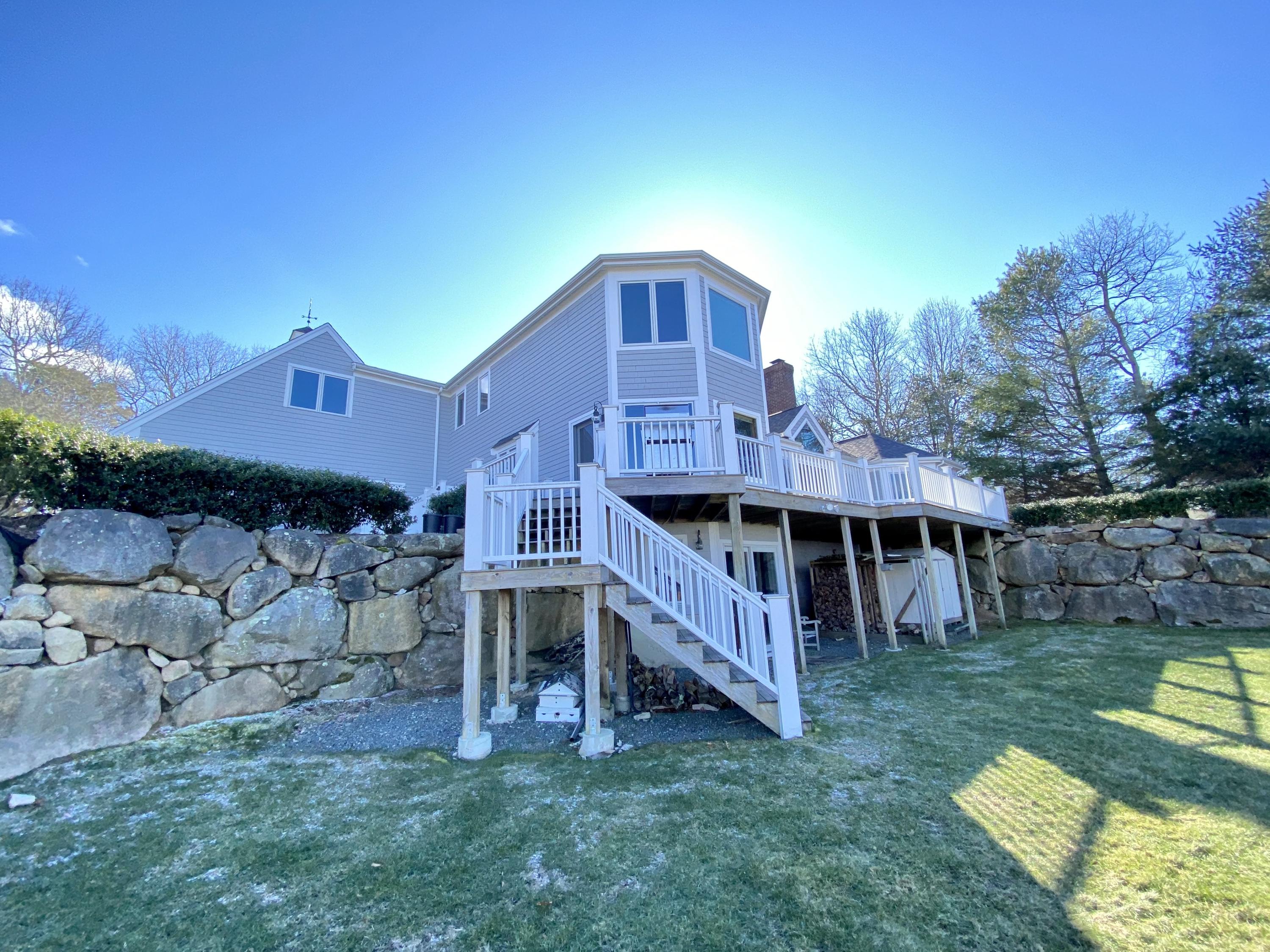 294 Cairn Ridge Road East Falmouth, MA 02536 - Photo 9 of 29 a view of a house with a yard and sitting area