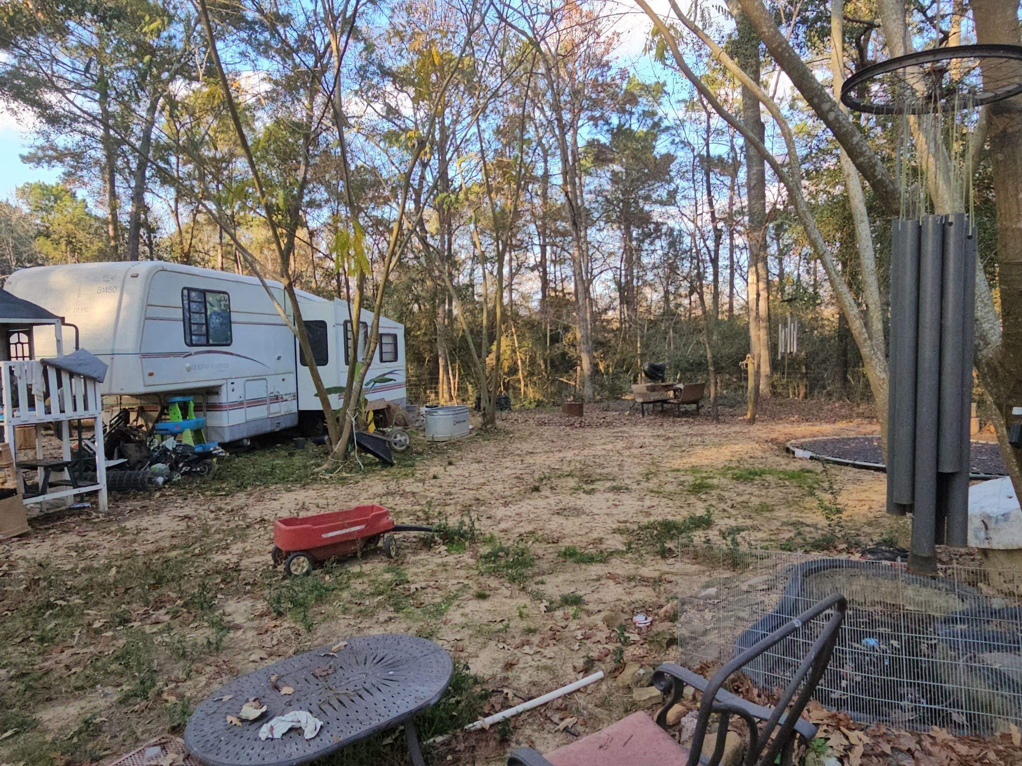 11814 Megan Road Conroe, TX 77303 - Photo 4 of 10 a backyard of a house with seating space