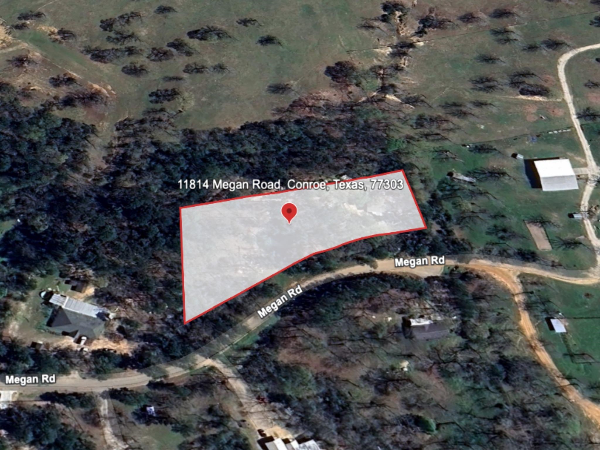 11814 Megan Road Conroe, TX 77303 - Photo 9 of 10 a view of a yard with a yard