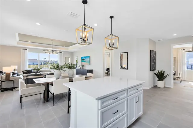 a view of a dining room with furniture and window
