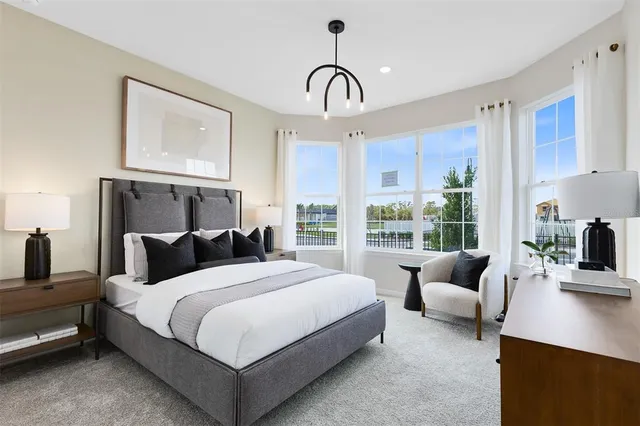 a bedroom with a bed and a sink