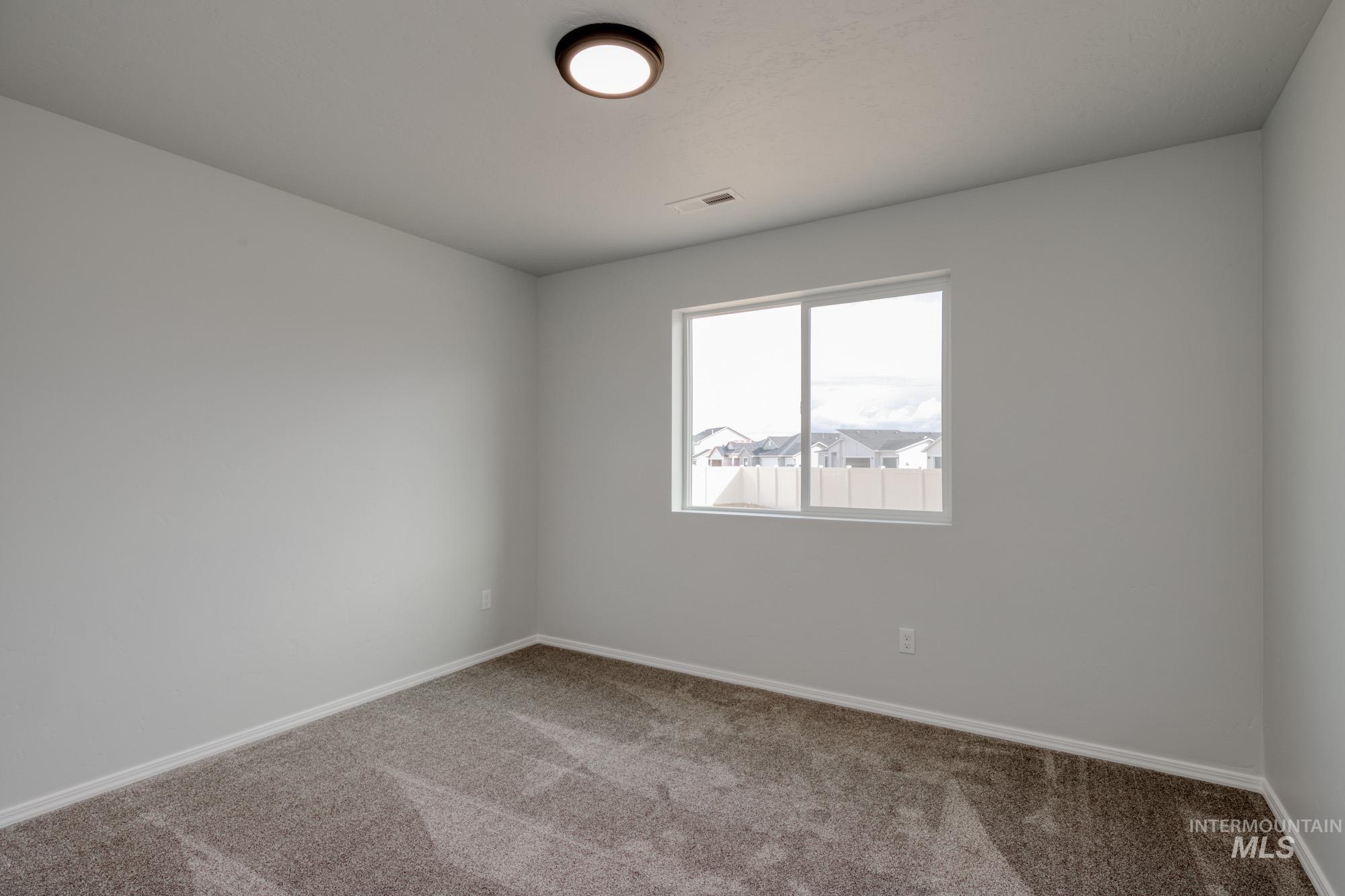 1666 Dyer Street Middleton, ID 83644 - Photo 16 of 22 Unfurnished room featuring carpet flooring and baseboards