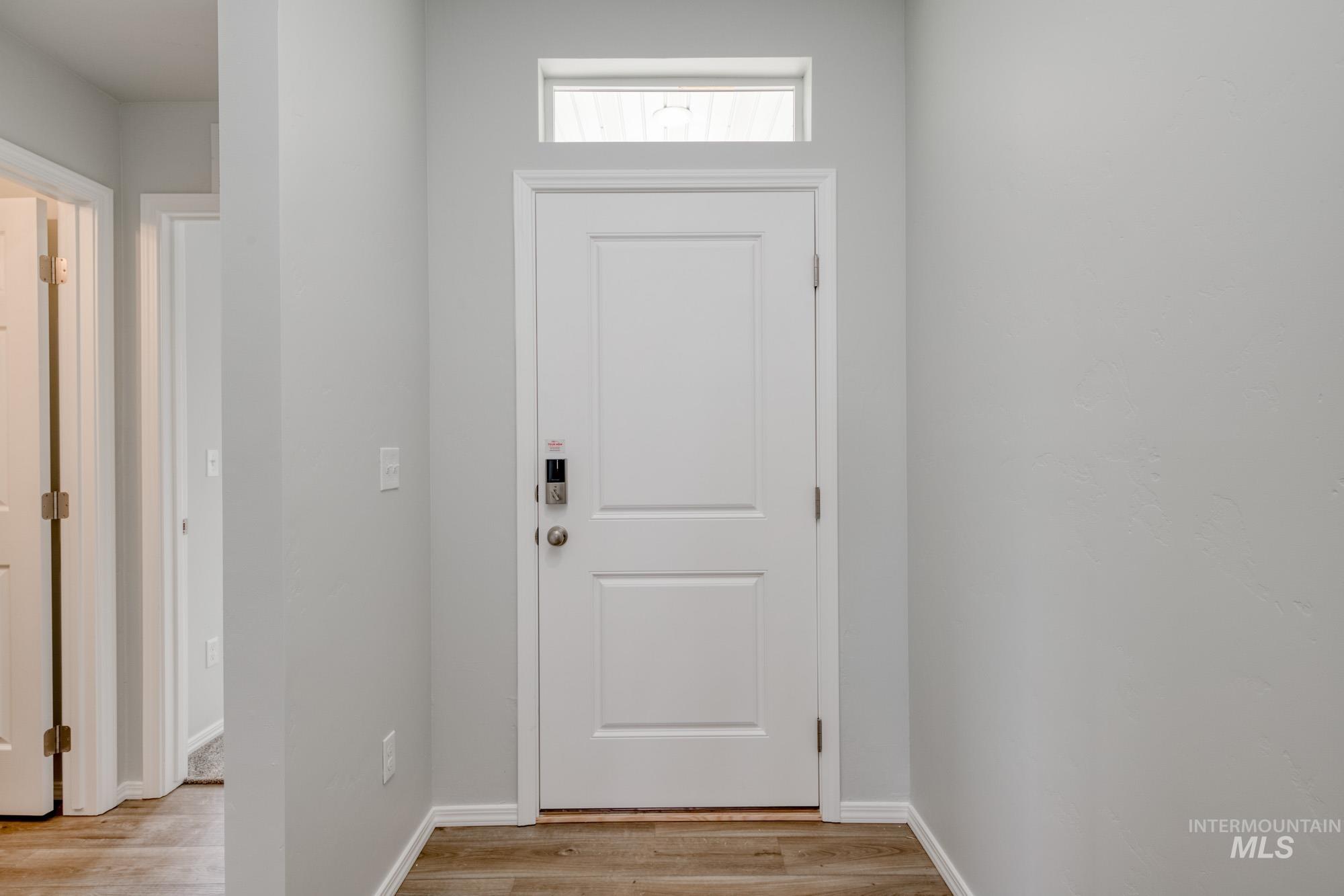 1666 Dyer Street Middleton, ID 83644 - Photo 2 of 22 Doorway to outside with wood finished floors and baseboards