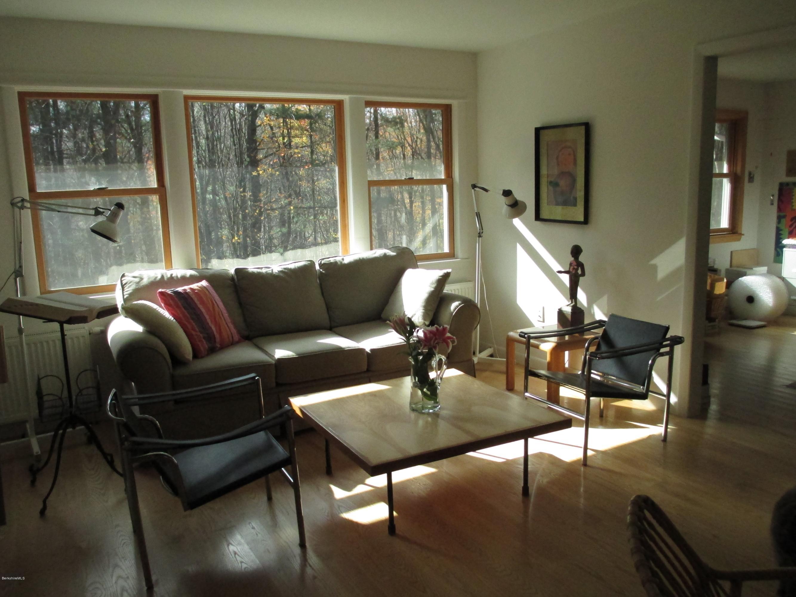 170 Leland Road Becket, MA 01223 - Photo 11 of 59 a living room with furniture and a large window