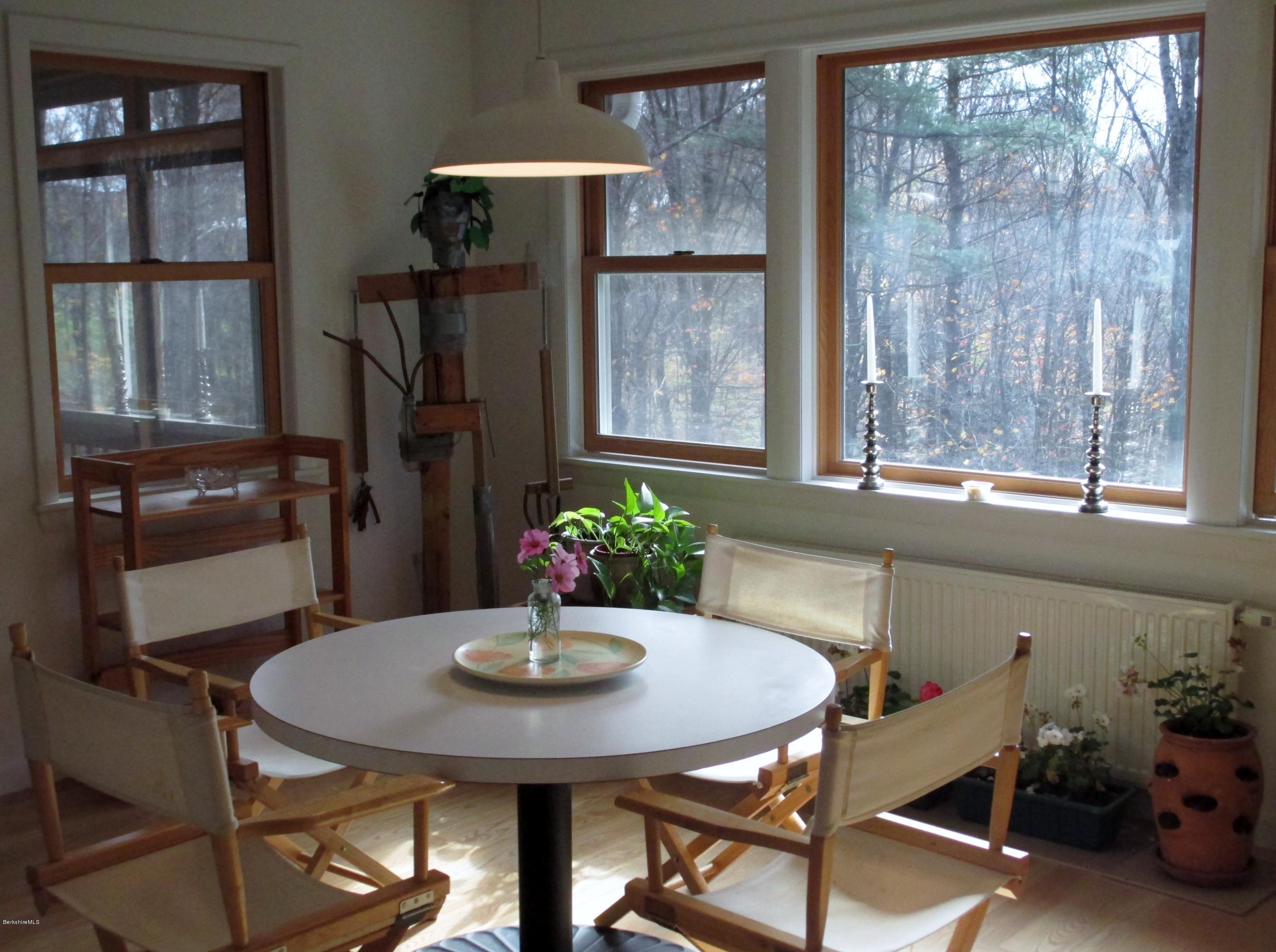 170 Leland Road Becket, MA 01223 - Photo 16 of 59 a view of a dining room with furniture and window