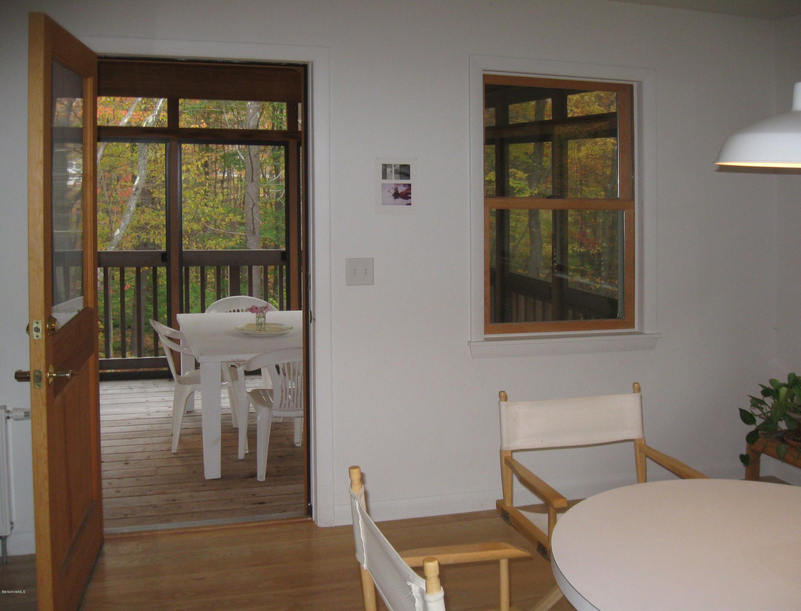 170 Leland Road Becket, MA 01223 - Photo 20 of 59 a room with a table and windows
