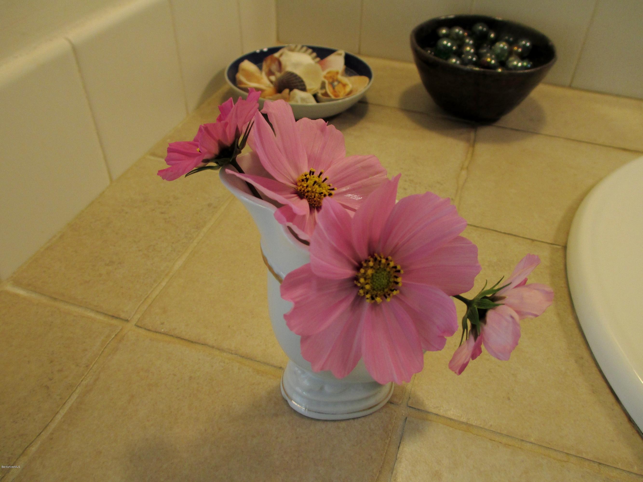 170 Leland Road Becket, MA 01223 - Photo 35 of 59 a vase of flowers sitting on a table