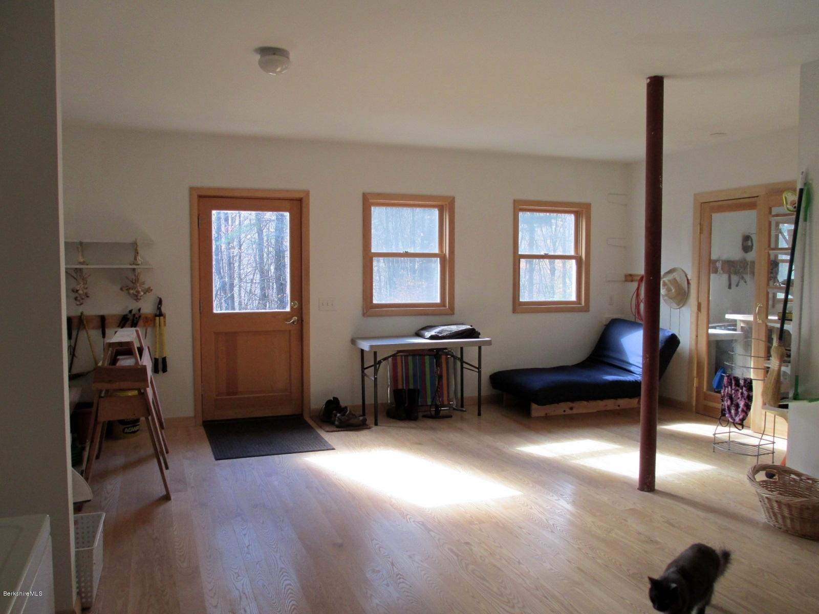 170 Leland Road Becket, MA 01223 - Photo 37 of 59 a living room with furniture and a window