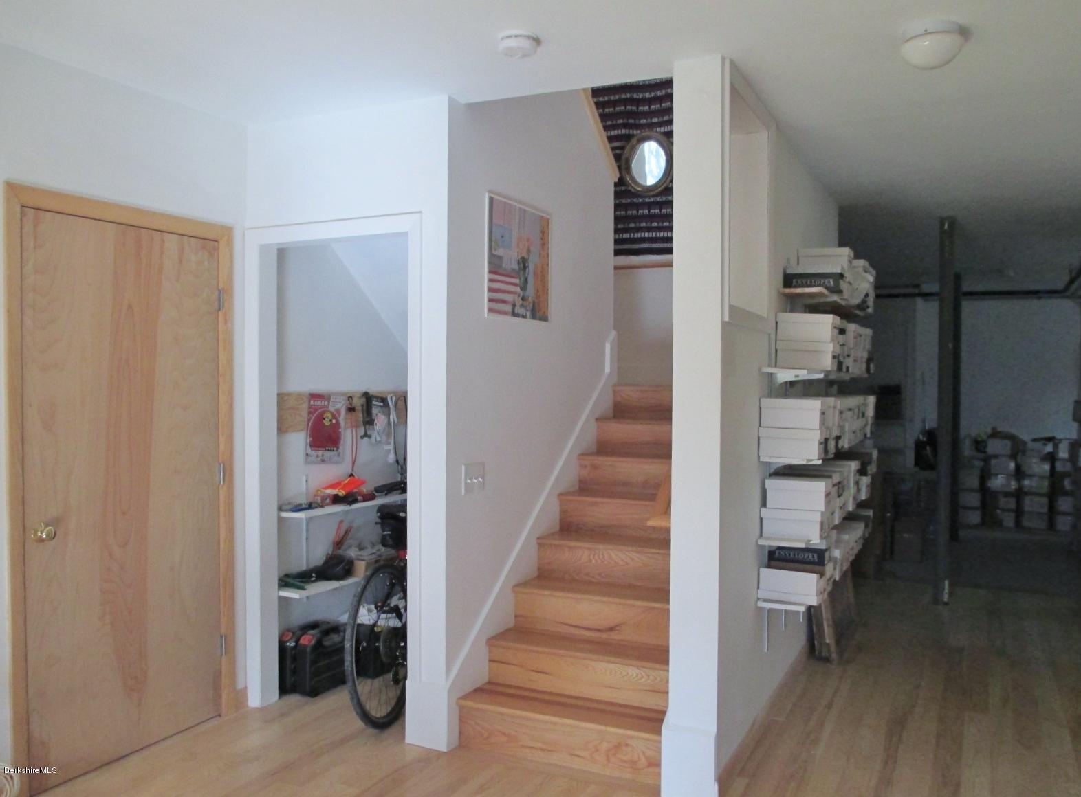 170 Leland Road Becket, MA 01223 - Photo 39 of 59 a view of a hallway with wooden floor and workspace