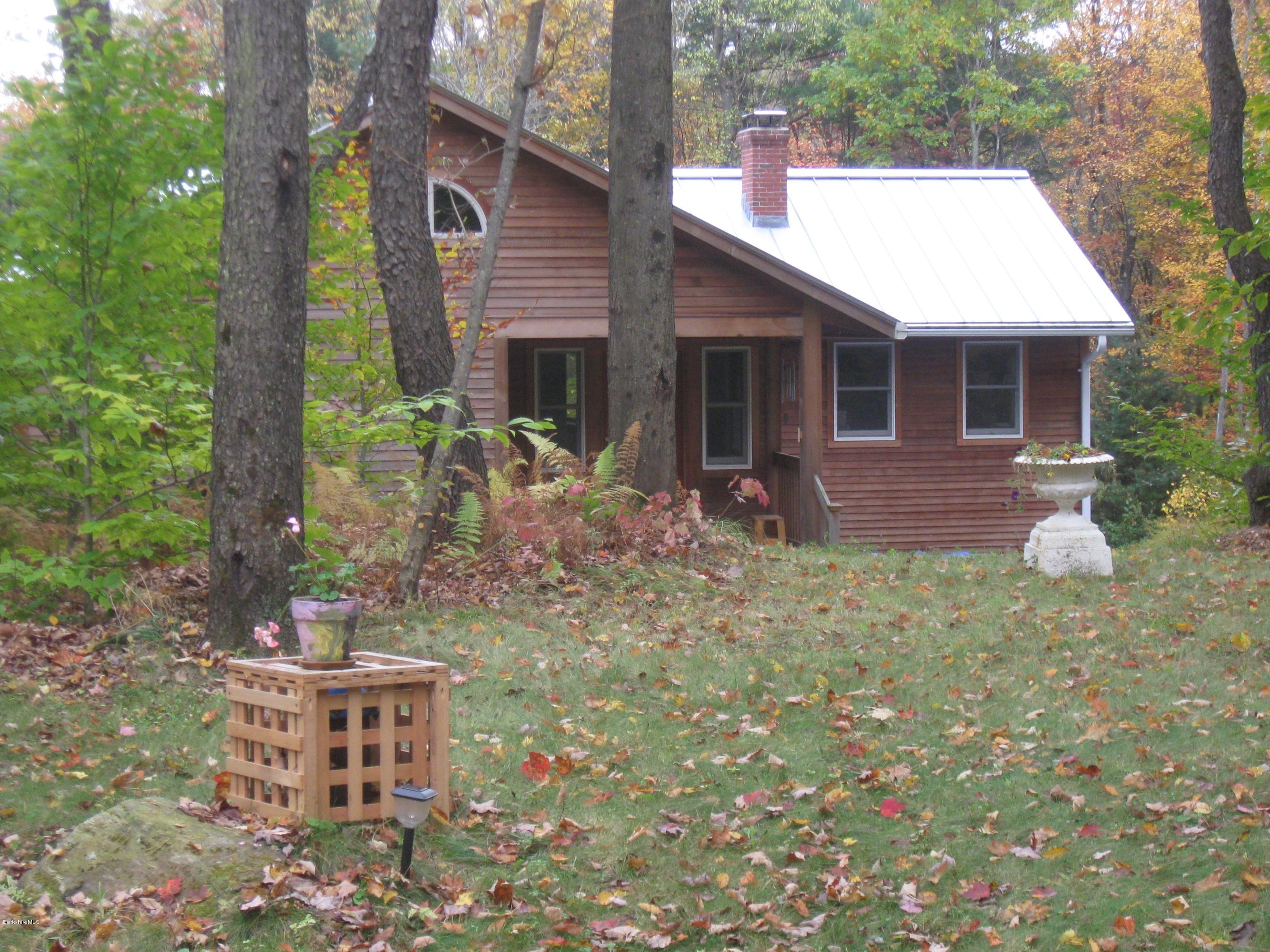 170 Leland Road Becket, MA 01223 - Photo 44 of 59 a backyard of a house with table and chairs