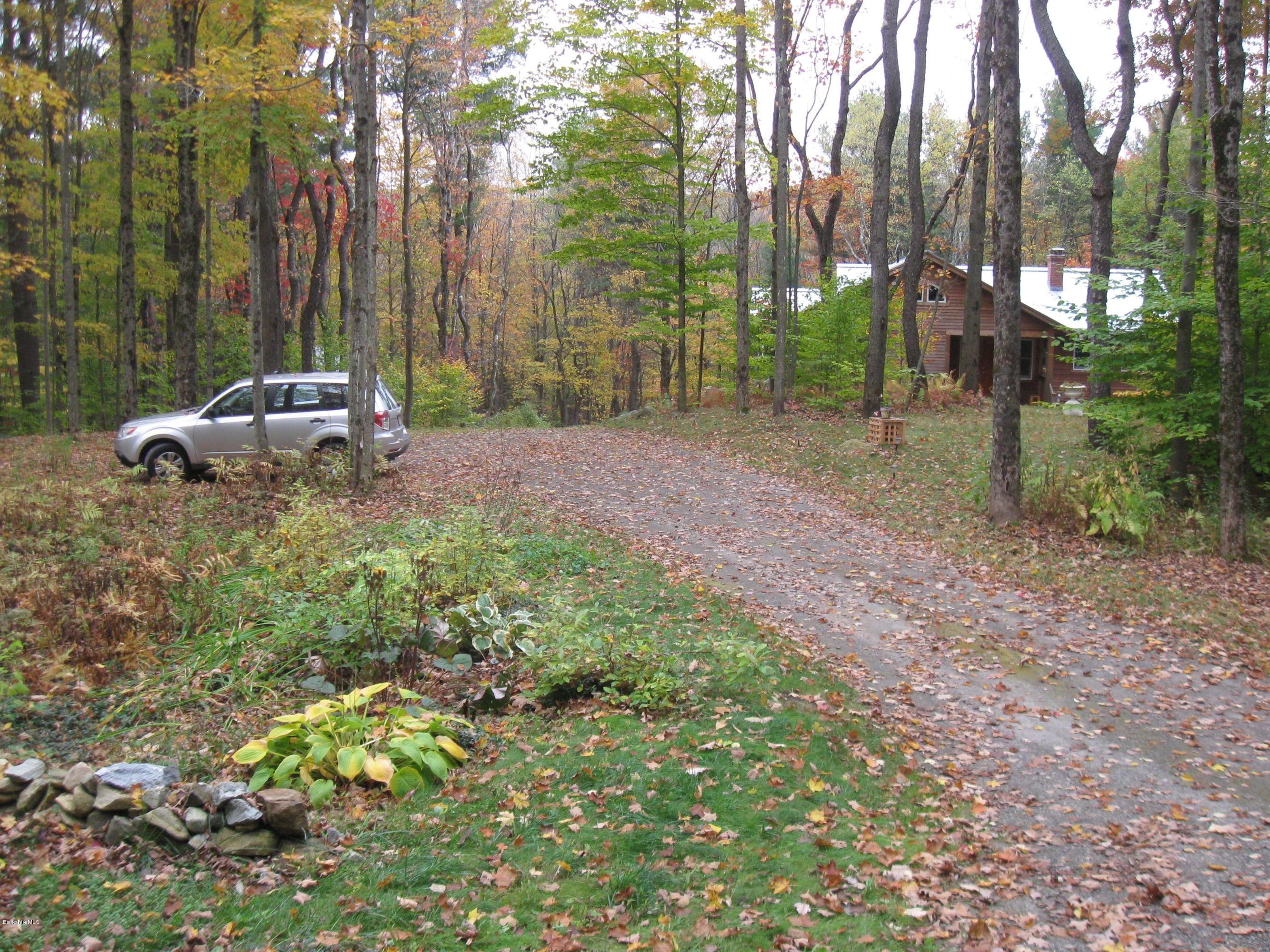 170 Leland Road Becket, MA 01223 - Photo 45 of 59 a view of a backyard with large trees