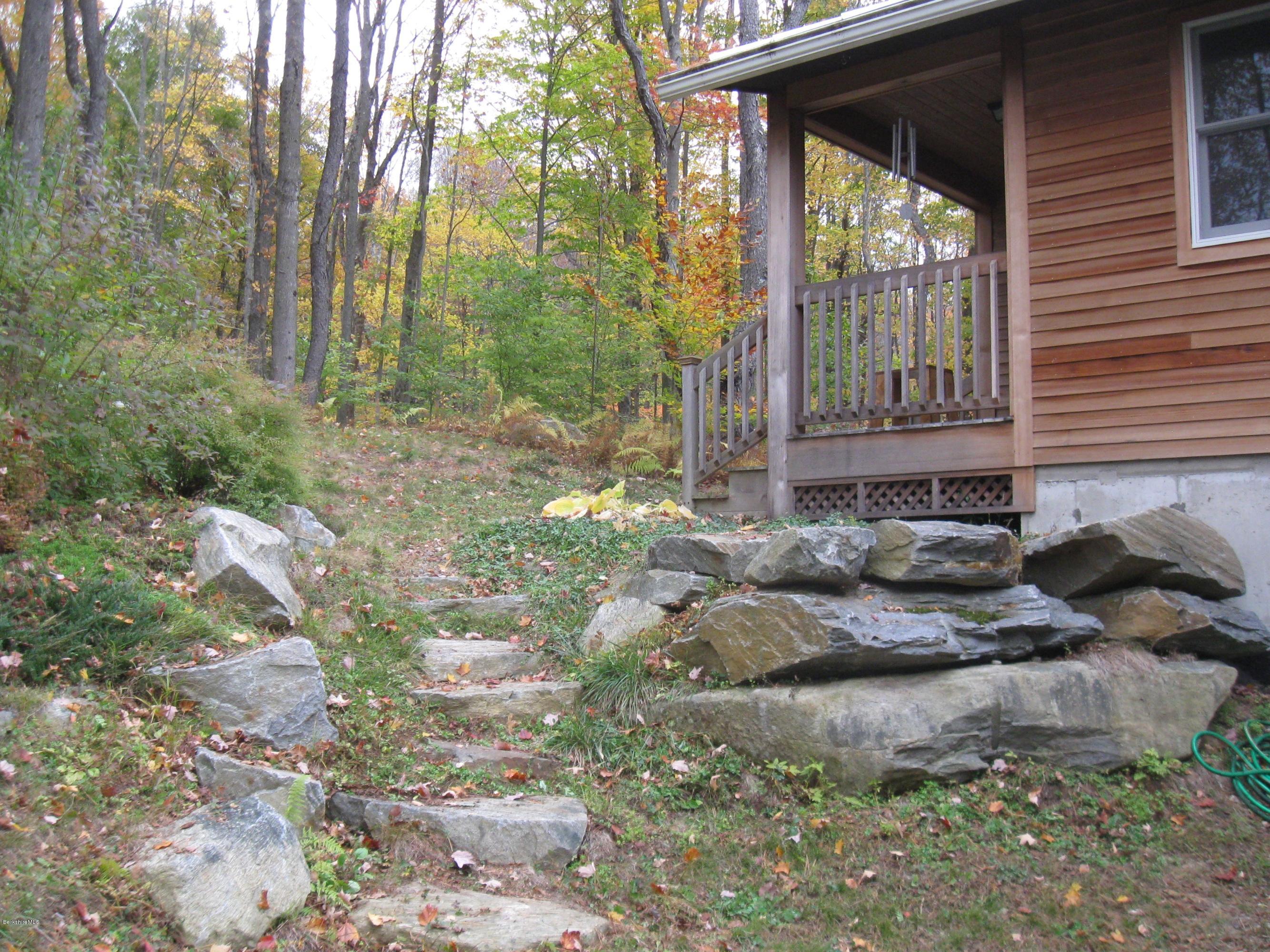170 Leland Road Becket, MA 01223 - Photo 46 of 59 a view of a house with a backyard and trees