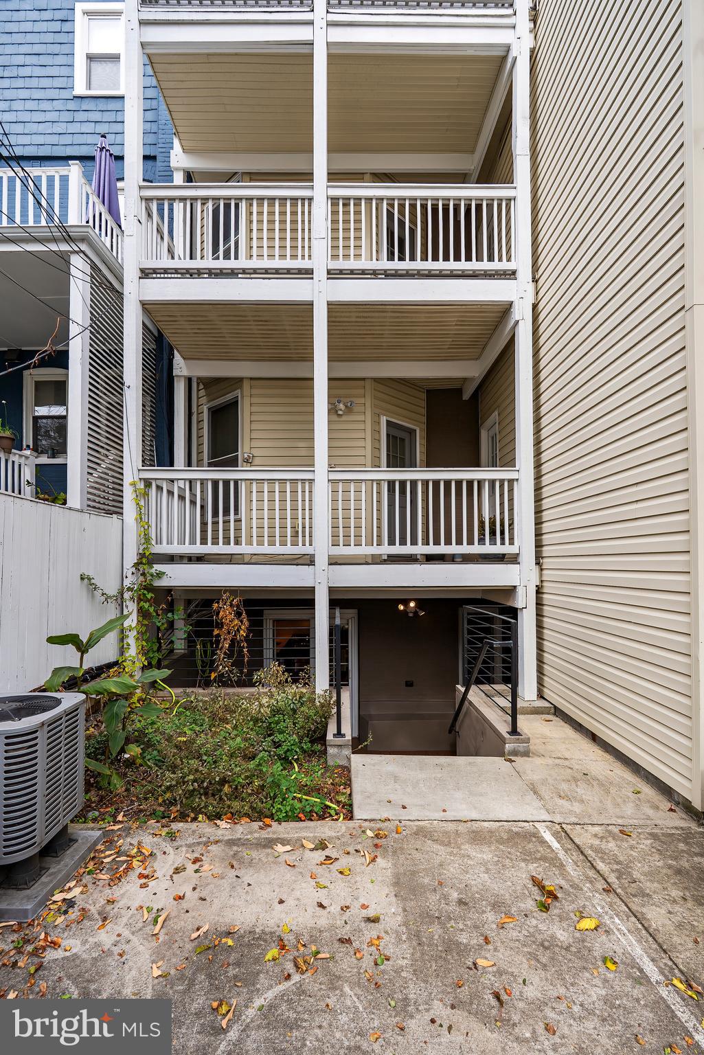 2616 Garfield Street Northwest, Unit 1 Washington, DC 20008 - Photo 20 of 22 a front view of a house with a yard
