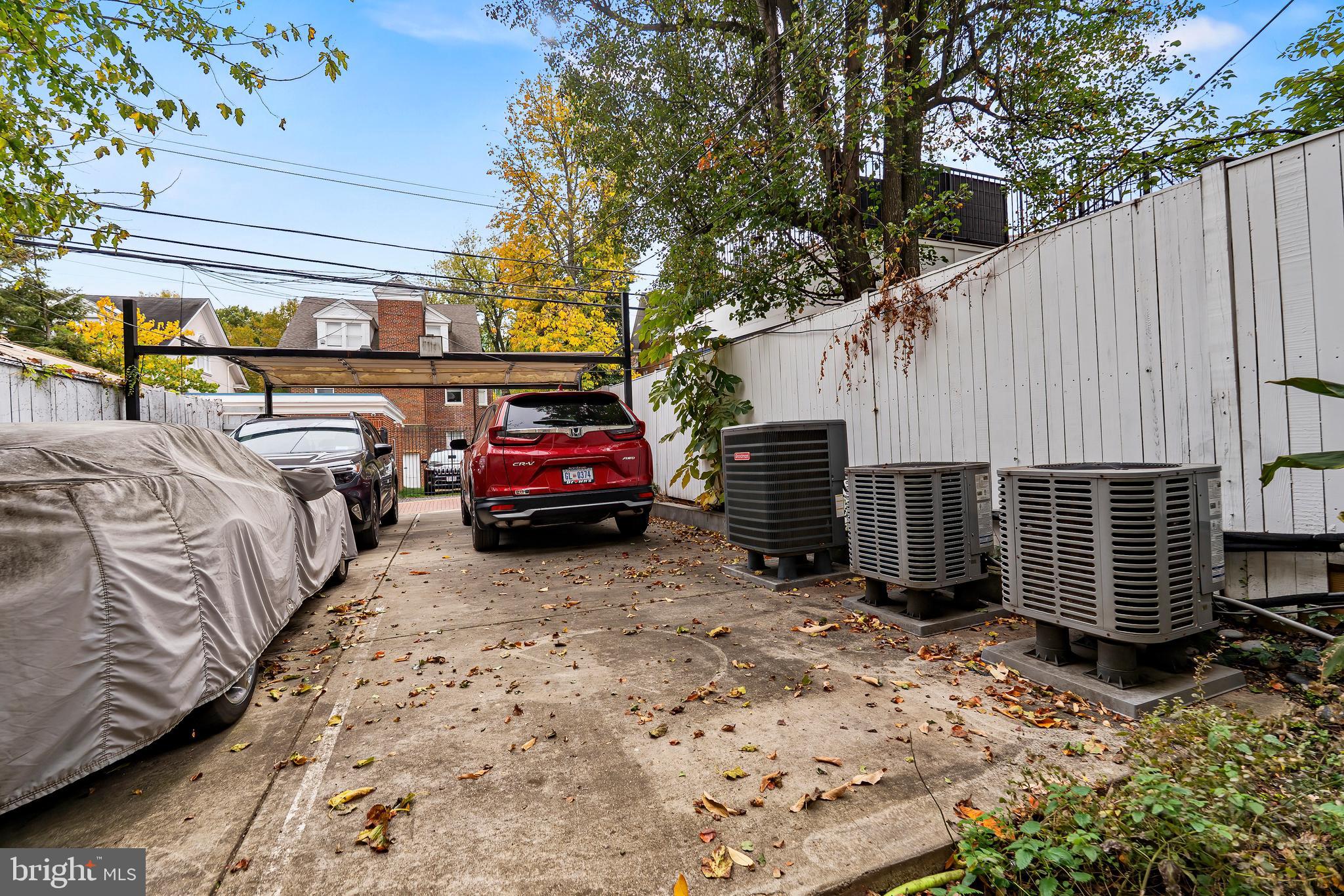 2616 Garfield Street Northwest, Unit 1 Washington, DC 20008 - Photo 21 of 22 a view of a backyard with a car parked in a yard