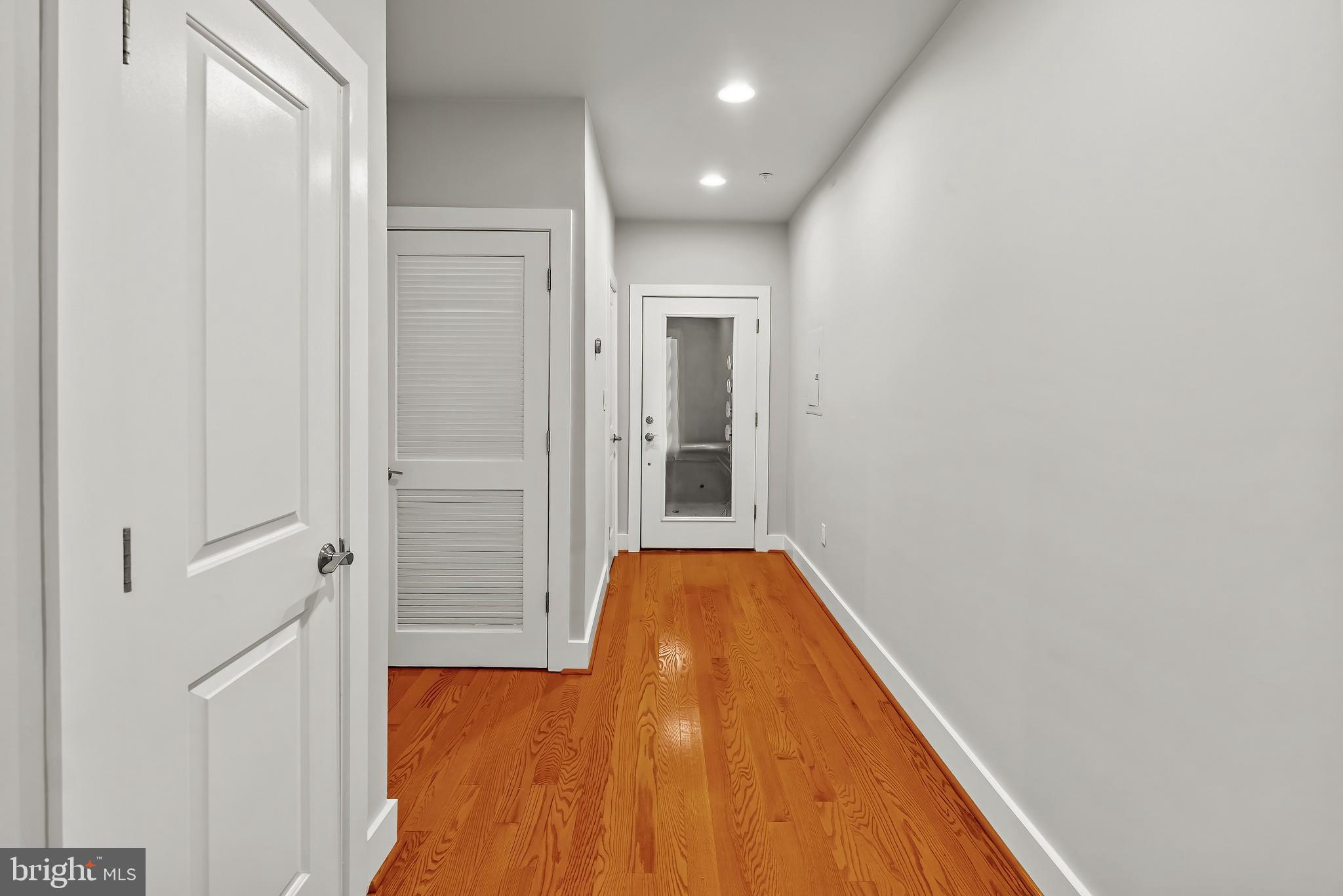 2616 Garfield Street Northwest, Unit 1 Washington, DC 20008 - Photo 5 of 22 a view of hallway with wooden floor