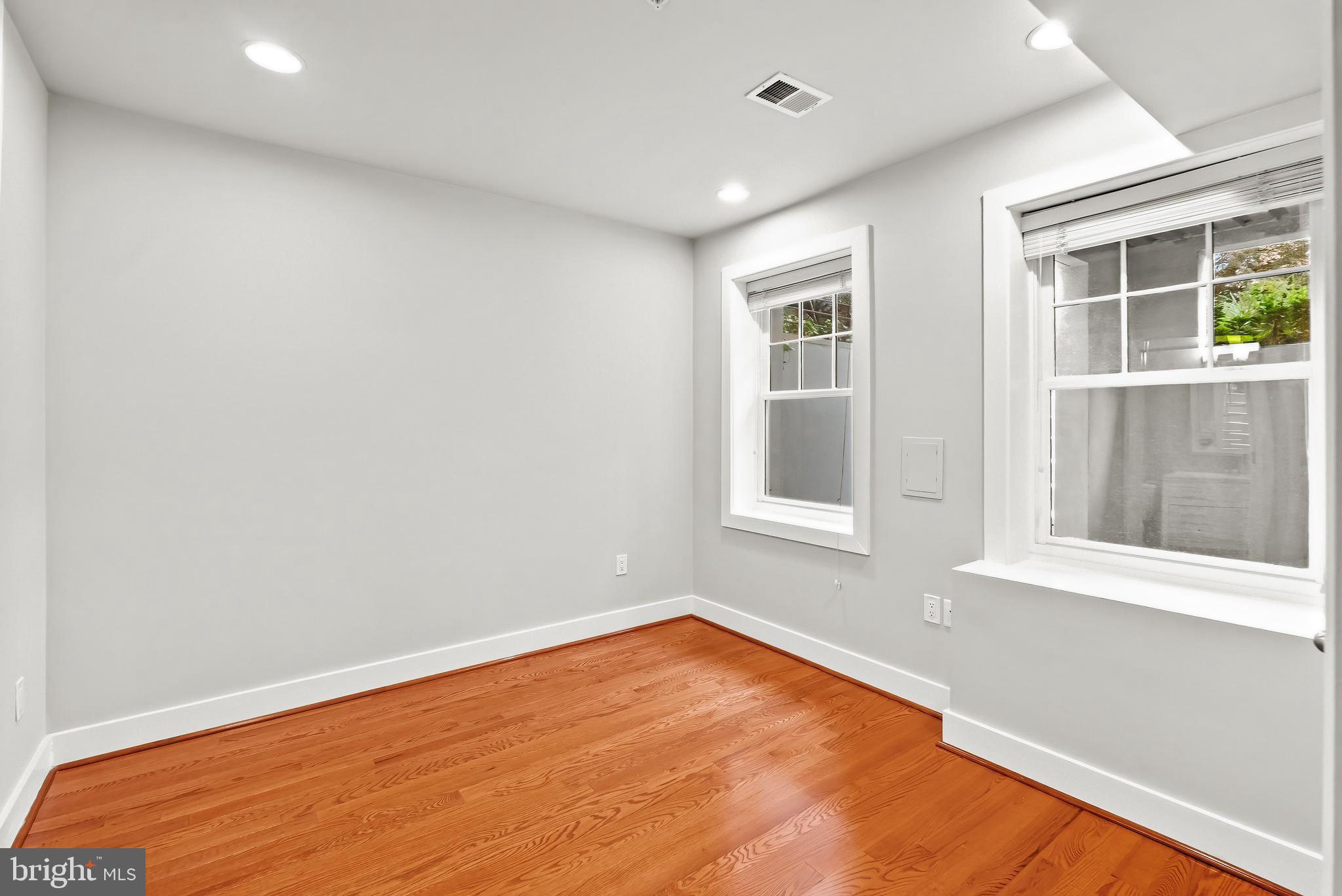 2616 Garfield Street Northwest, Unit 1 Washington, DC 20008 - Photo 6 of 22 an empty room with a window