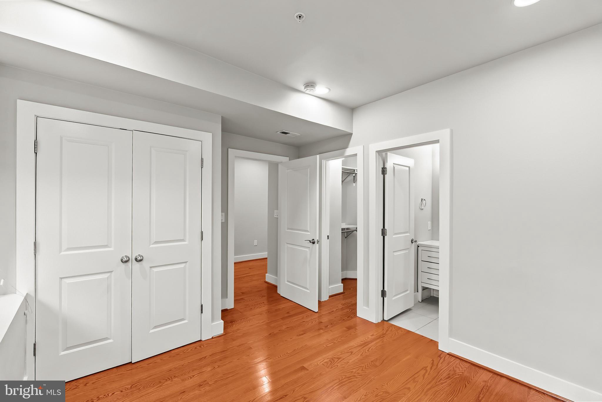 2616 Garfield Street Northwest, Unit 1 Washington, DC 20008 - Photo 7 of 22 wooden floor with white walls