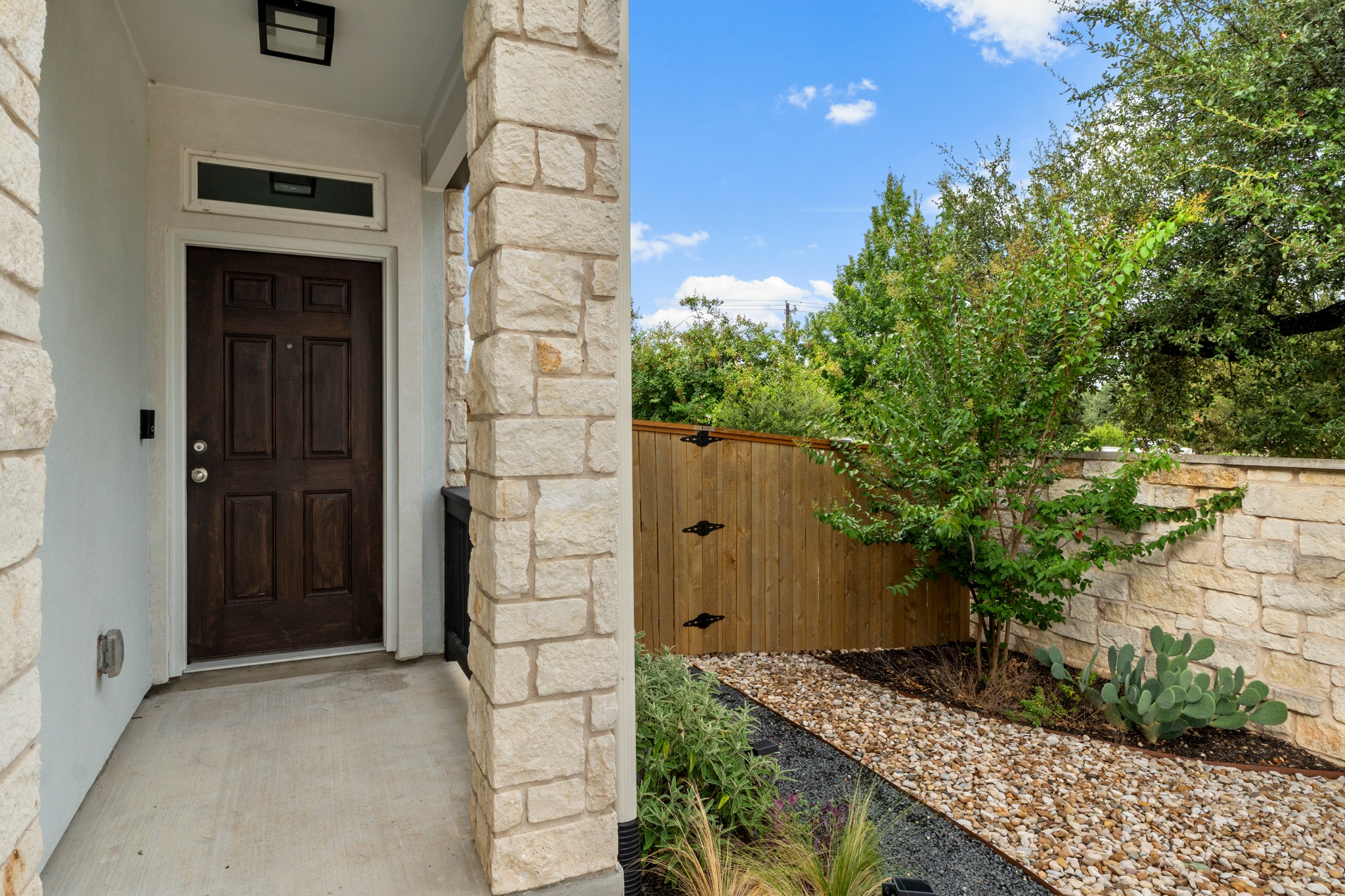 2251 Rocoso Trail Leander, TX 78641 - Photo 3 of 34 A welcoming front entry features a classic wood door and elegant stone pillars.