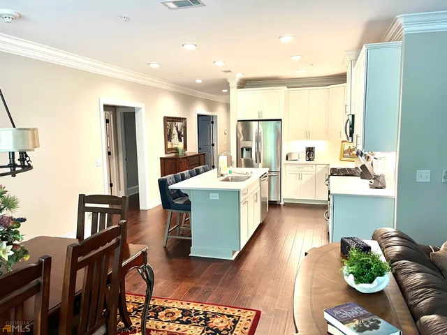 a room with furniture and view of living room