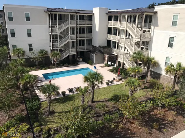 a view of swimming pool with outdoor seating