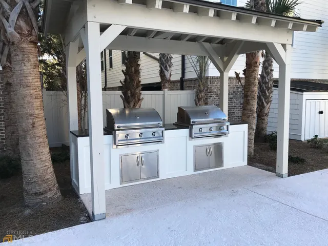 a kitchen with a stove and a refrigerator