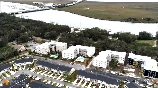 a view of a terrace with couches and sky view