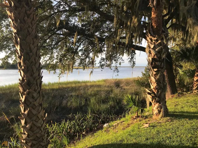 a view of lake with green space