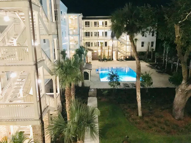 a swimming pool with outdoor seating and yard