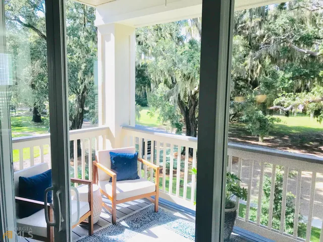 a view of a chair and table in balcony