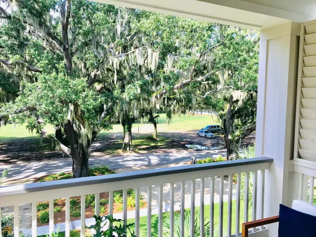 a view of a trees from a balcony