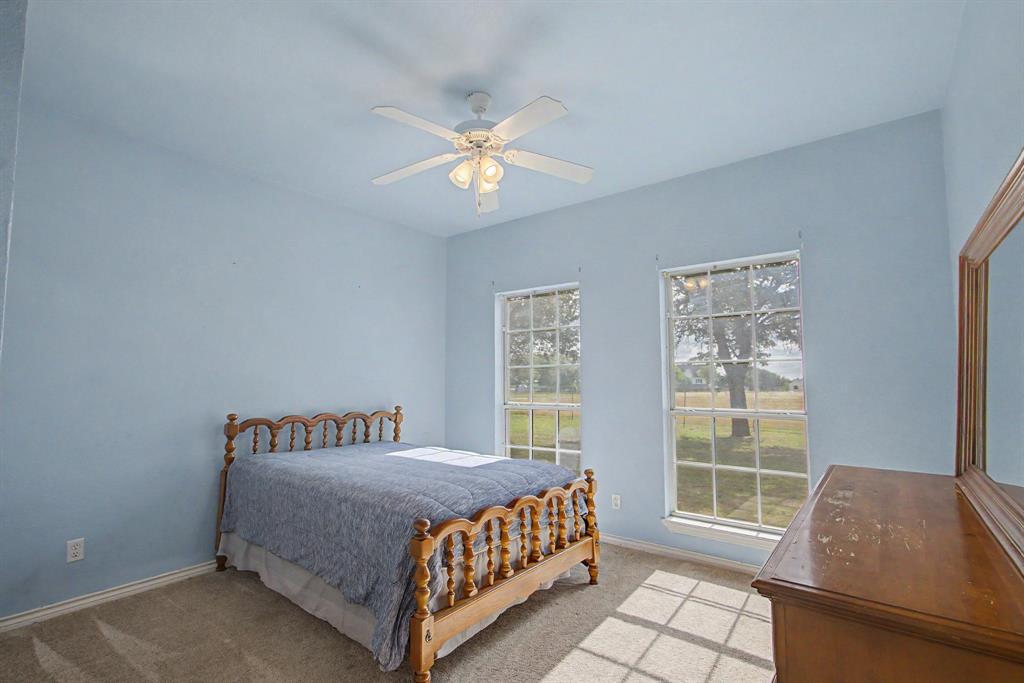 483 Christy Kay Lane Rhome, TX 76078 - Photo 23 of 40 a bedroom with a bed and a window